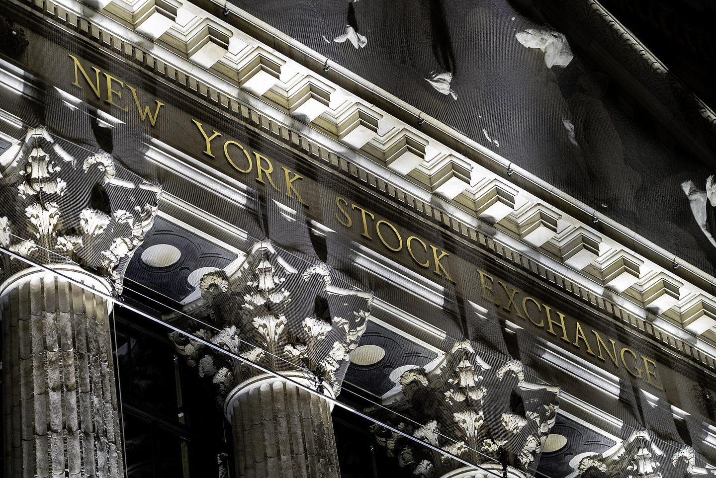 The gilded New York Stock Exchange lettering above the columns on Broad Street.